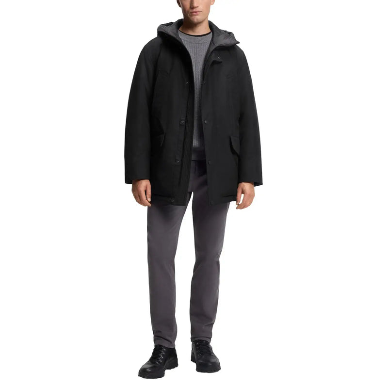 Veste Boss pour homme, parka longue noire à capuche en polyester, au design moderne et élégant, avec doublure intérieure grise discrète.