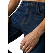 Jean homme bleu foncé en coton stretch, coupe classique cinq poches, coutures robustes, style Boss.
