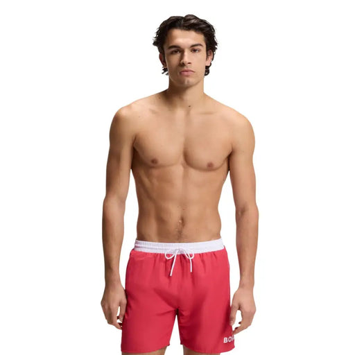 Red Boss men swimwear swim trunks with white elastic waistband drawstring and boss logo on lower right leg
