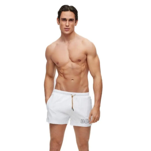 White Boss men swim trunks featuring a gold-tone drawstring and subtle logo on lower left leg for swimwear use