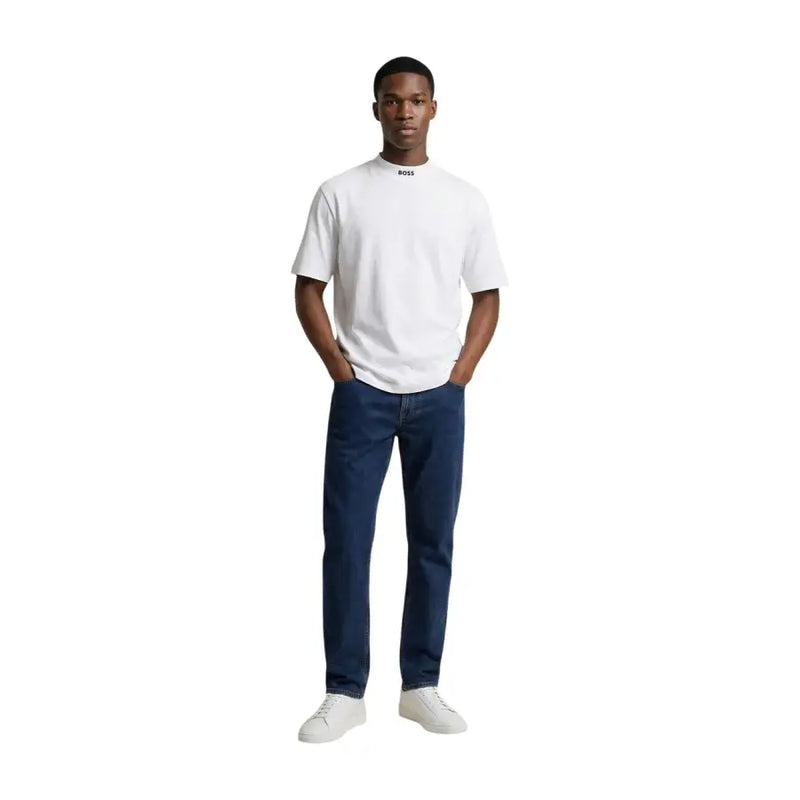 White boss men t shirt round neck cotton elastane with subtle logo paired with dark blue jeans and white sneakers