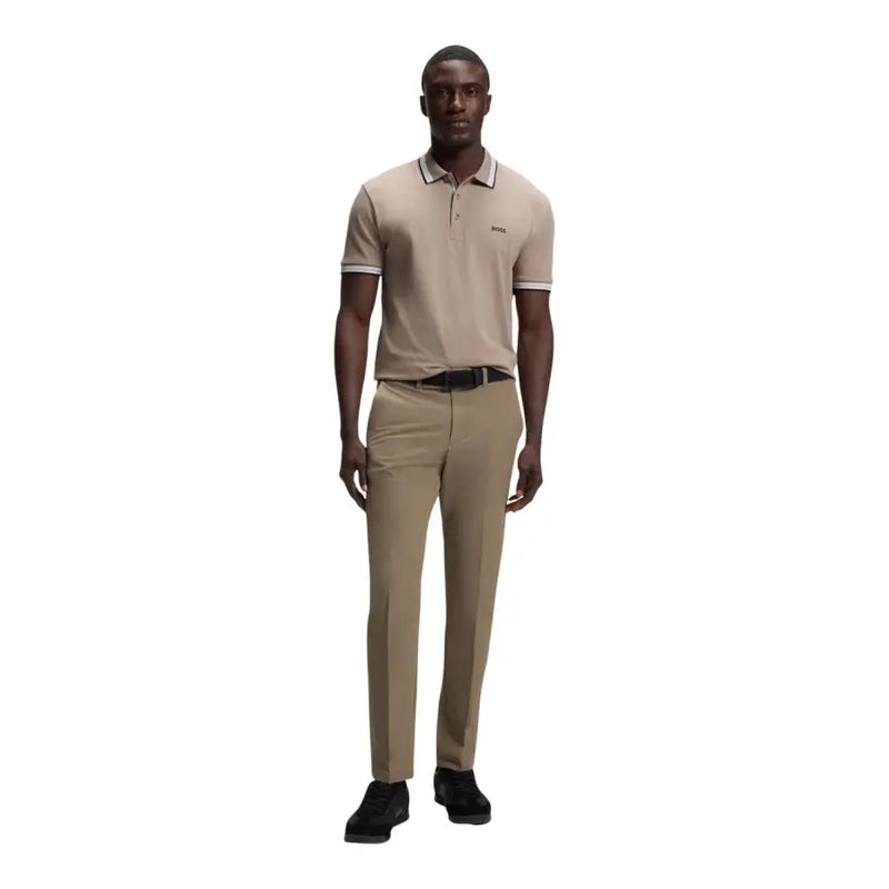 Beige Hugo Boss polo shirt with white trim and subtle chest logo paired with Boss men trousers