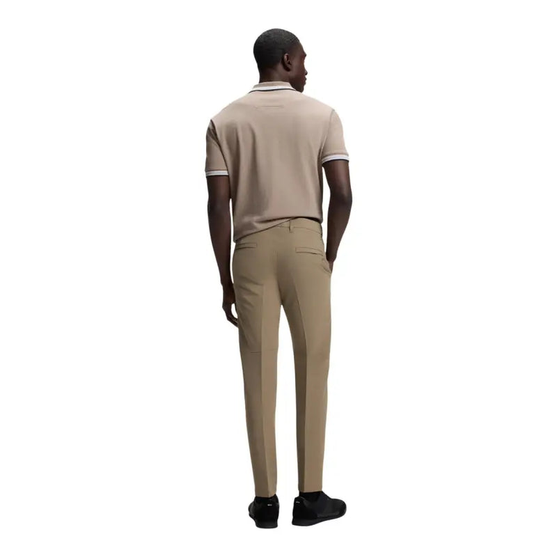 Beige short-sleeved polo shirt with white trim on collar and cuffs complementing boss men trousers collection