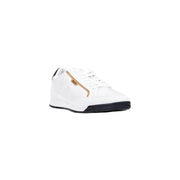 White leather sneaker with gold accents and black sole, possibly by reebok.