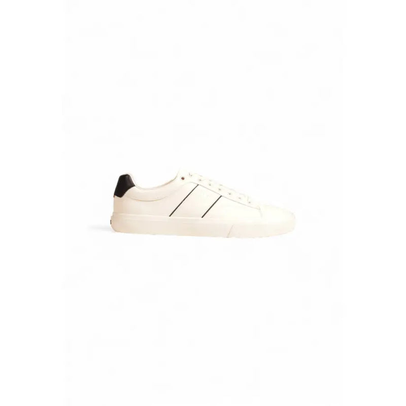 White leather low-top sneaker with black accents and rubber sole.