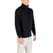 Pull à col roulé en laine Boss pour homme, noir, avec un discret logo sur la poitrine, vue de face