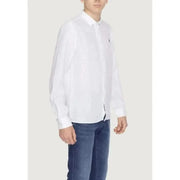 Boy in U.S. Polo Assn. men shirt and jeans showcasing urban style clothing