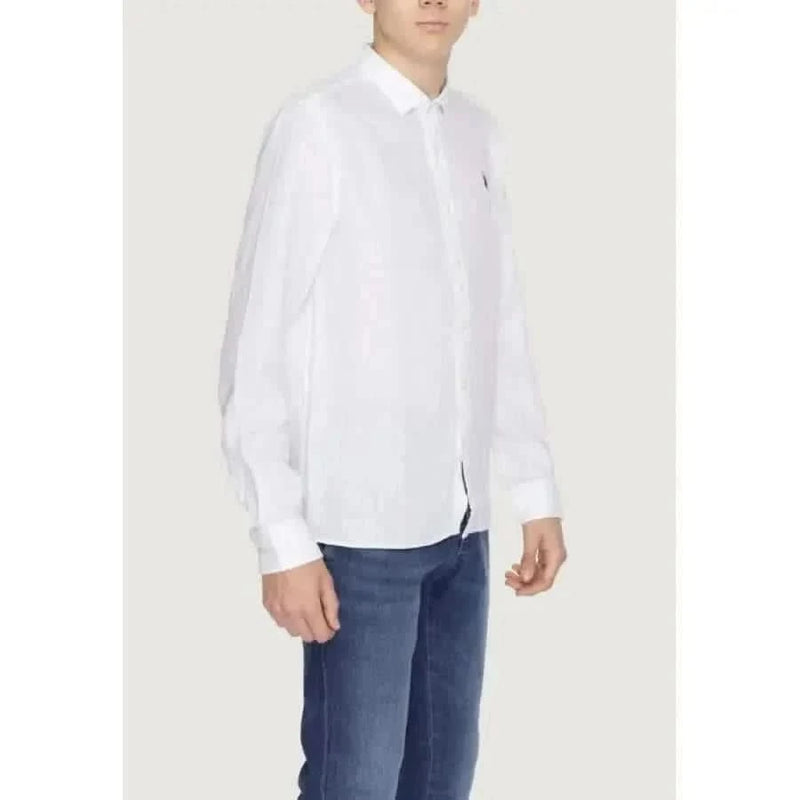 Boy in U.S. Polo Assn. men shirt and jeans showcasing urban style clothing