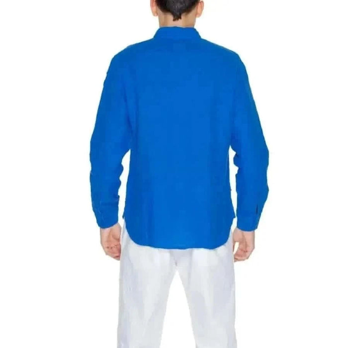 Man wearing Blauer Men Shirt in bright blue long sleeves facing away from camera