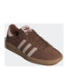 Brown Adidas sneaker with pink accents and pink stripes for stylish athletic wear
