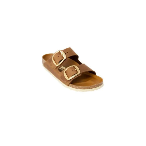 Brown leather Birkenstock women’s sandals featuring elegant gold buckles