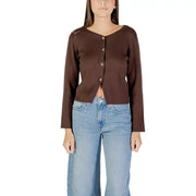 Brown long-sleeved V-neck button-up cardigan paired with light blue wide-leg jeans for women