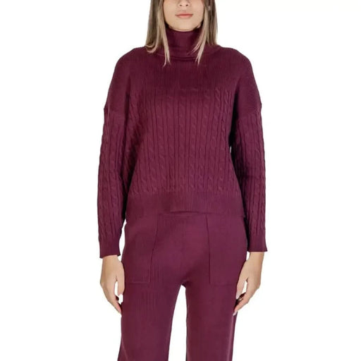 Burgundy cable-knit turtleneck sweater and pants set by Clerè Women’s Bordeaux collection