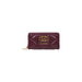 Burgundy quilted leather wallet with gold logo and hardware displayed prominently