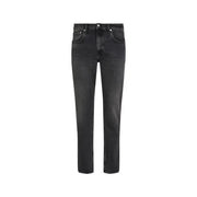 Black slim fit jeans with a distressed look and button fly design.