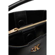 Calvin Klein black leather handbag with shoulder strap gold-tone zipper and logo hardware front view