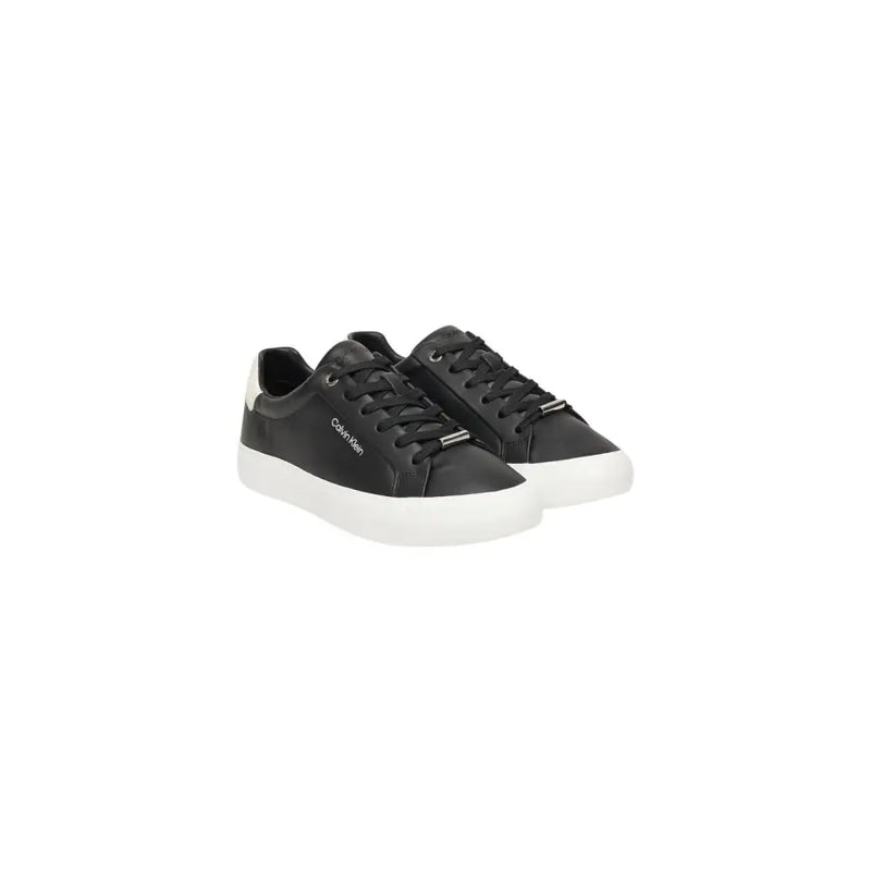 Calvin Klein black leather slip on sneakers for women with white rubber soles and a sleek minimalist design