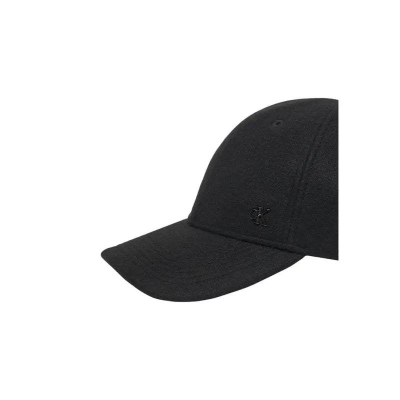 Black baseball cap with adjustable strap and logo on brim.