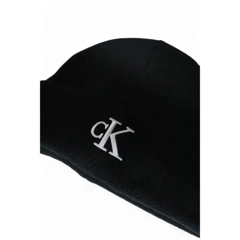 Black calvin klein beanie with silver logo.