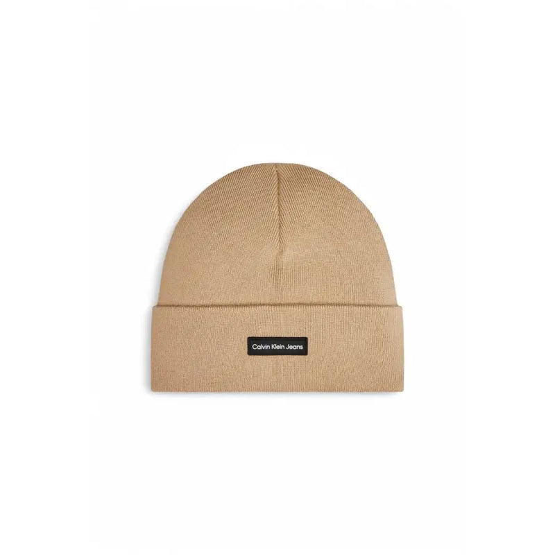 Beige calvin klein beanie with textured pattern and logo label.
