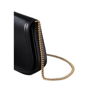 Calvin Klein black polyester shoulder bag with black leather crossbody design and gold-tone twisted chain strap