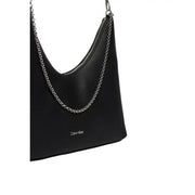 Calvin Klein black textured leather shoulder bag with silver chain strap and zip pocket for secure storage