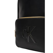 Calvin Klein black rucksack with glossy finish and gold-tone zipper featuring multiple zip pockets