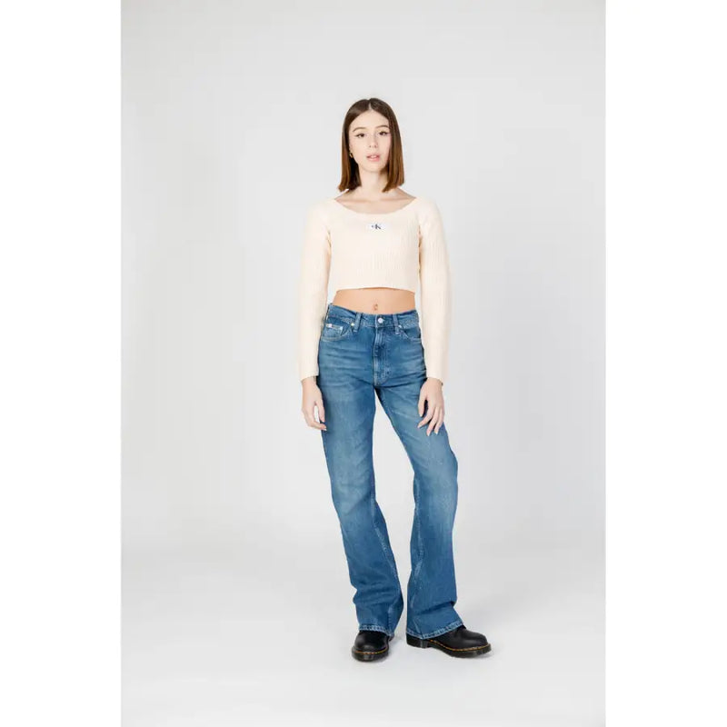 Calvin Klein blue women’s denim flare jeans with worn-out effect showcasing the back side of the product