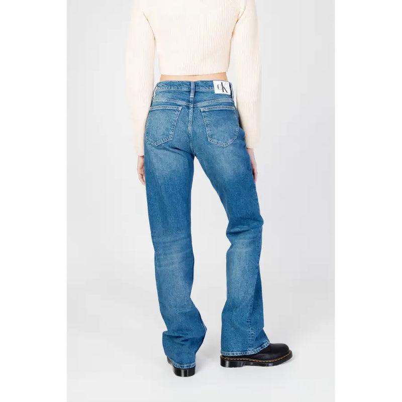 Back view of calvin klein blue womens denim flare jeans with worn out effect and classic pocket design