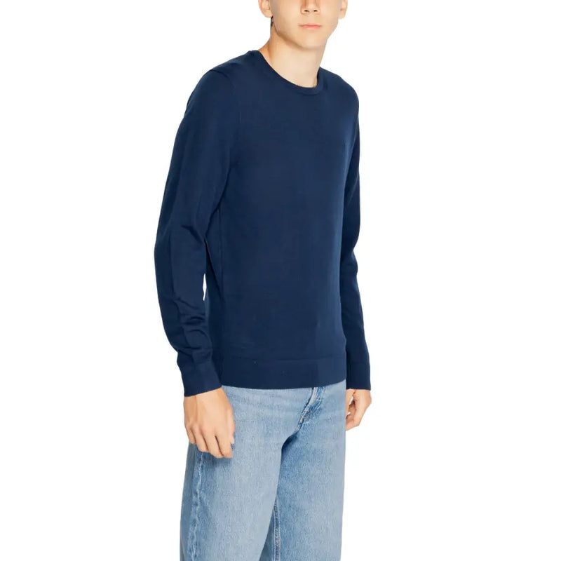 Navy blue wool long-sleeved crew neck sweater for men by Calvin Klein suitable for casual and formal wear
