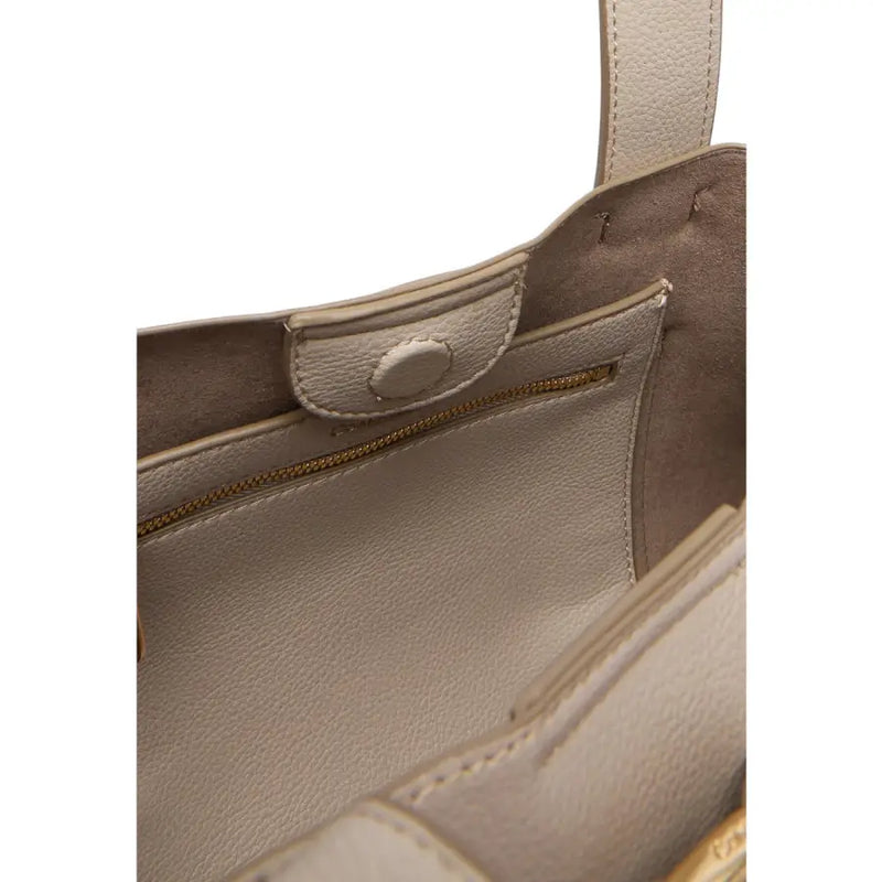 Beige leather tote bag with gold zipper and stitched handles featured as a Calvin Klein grey polyurethane handbag with inside pocket