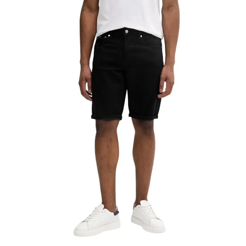 Black denim shorts with white stitching and pockets, classic fit.