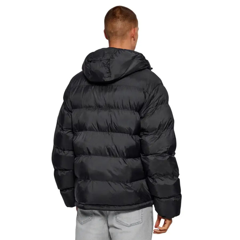 Black puffer jacket with hood and quilted design, likely made of synthetic material.