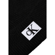 Calvin Klein Jeans black men’s ribbed knit beanie with white label and black ck logo fall winter collection