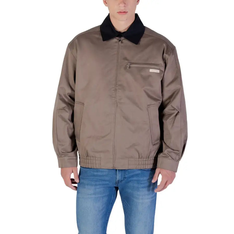 Brown bomber jacket with black collar and pockets, likely made of nylon or polyester.