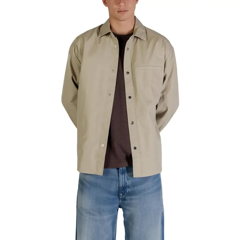 Blazer Calvin Klein Jeans pour homme, beige, en coton, coupe classique, fermeture boutonnée, col classique et poche poitrine.