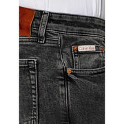 Calvin Klein Jeans Jean beige en coton pour homme, coupe classique, en denim noir avec empiècements en cuir marron délavé et rivets en cuivre à l'arrière.