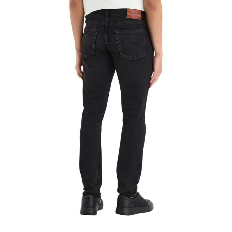 Calvin Klein Jean homme noir en denim de coton, coupe slim, délavage subtil aux cuisses