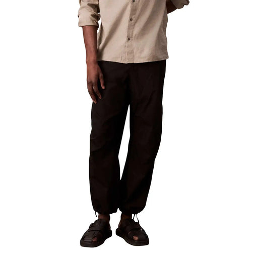 Calvin Klein Jeans Pantalon noir pour homme en coton et nylon, coupe fuselée décontractée et taille à cordon.