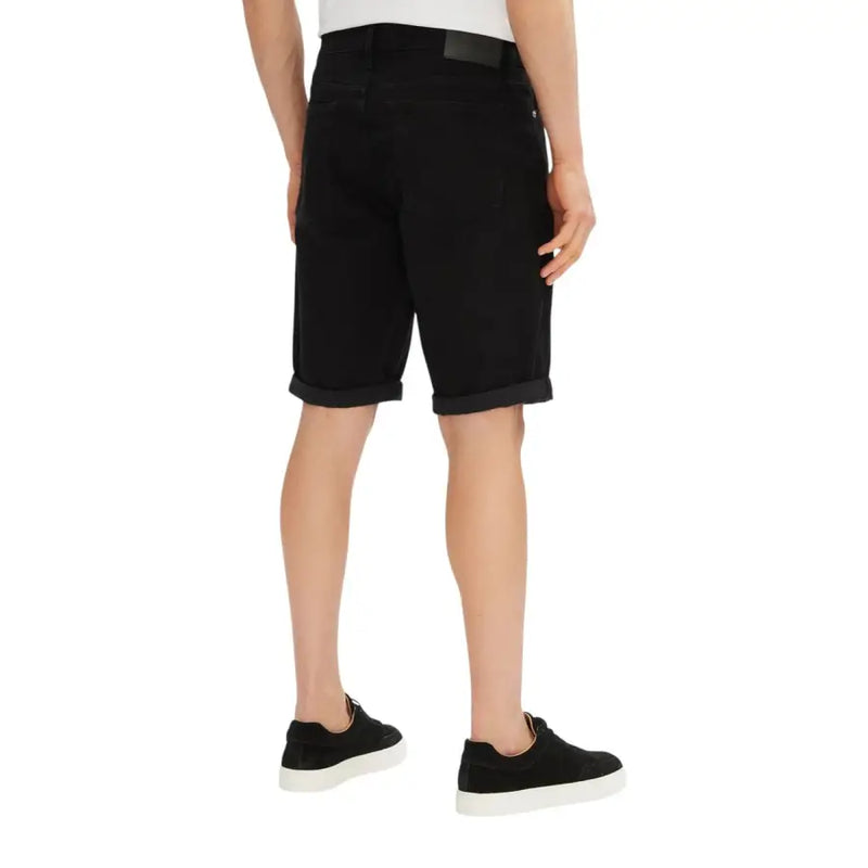 Black cotton casual shorts with rolled hem and belt loop.