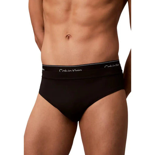 Calvin Klein Jeans men black briefs with white logo waistband designed for swimwear use