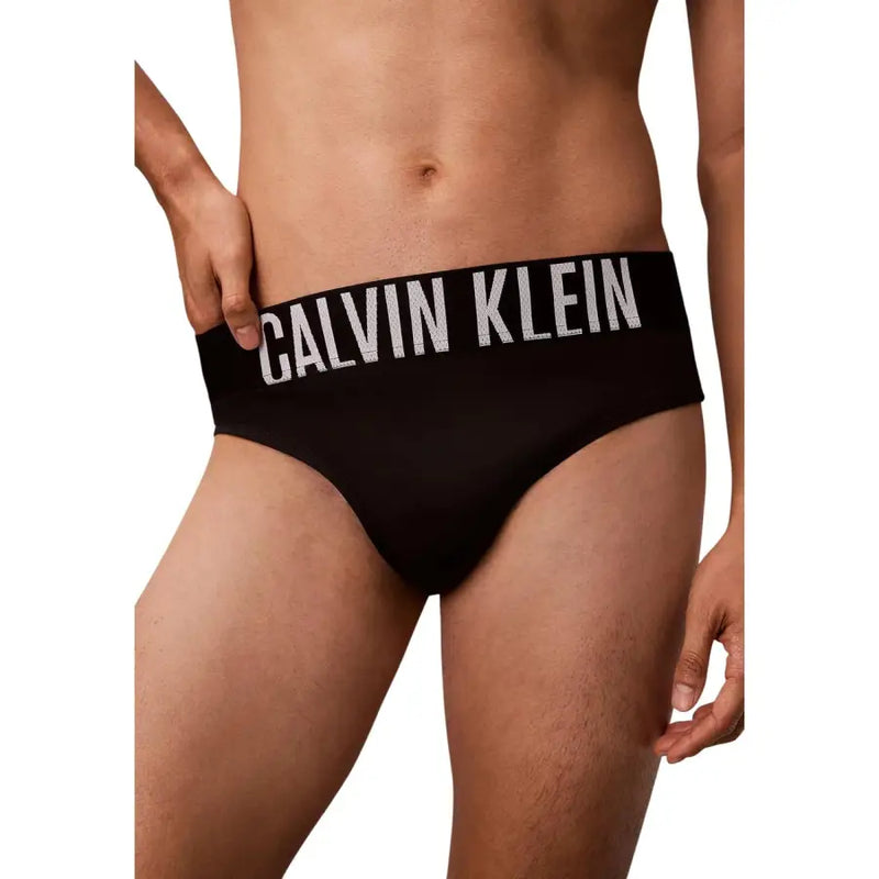 Slip de bain homme Calvin Klein Jeans noir en polypropylène avec bande logo blanche bien visible à la taille
