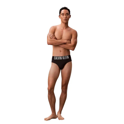 Black Calvin Klein Jeans men swimwear polypropylene briefs with white logo band on the waistband