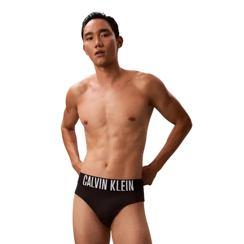 Calvin Klein Jeans slip de bain noir pour homme en polypropylène avec ceinture à logo blanc