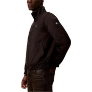 Noir Calvin Klein Jeans Blazer zippé pour homme, veste en polyester avec logo blanc discret brodé sur la poitrine et la manche.