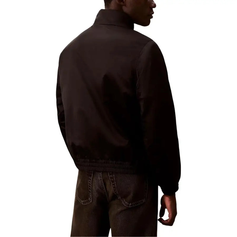 Veste bomber noire pour homme Calvin Klein Jeans, avec ceinture côtelée et tissu en polyester mat lisse.