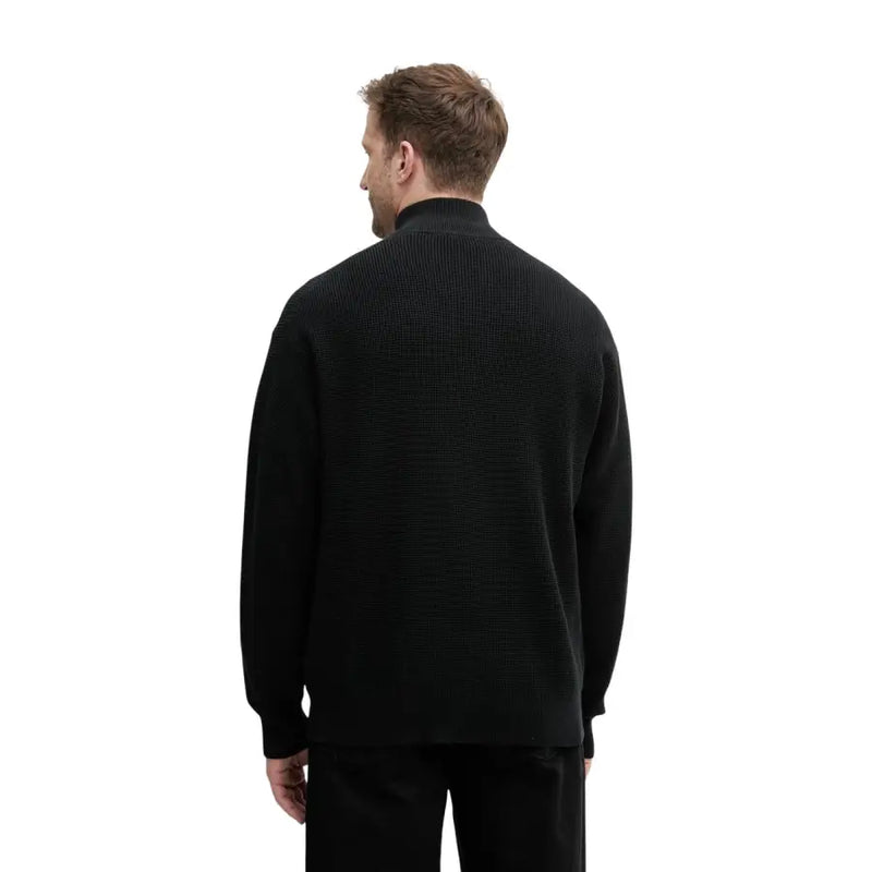 Pull en maille gaufrée noire Calvin Klein Jeans pour homme, col montant et fermeture éclair.