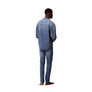 Jean slim en denim de coton bleu pour homme, avec étiquette Calvin Klein sur la poche arrière