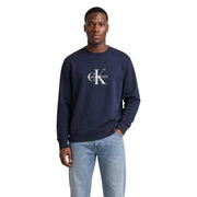 Navy blue Calvin Klein Jeans men cotton round neck sweatshirt with white CK logo on the chest