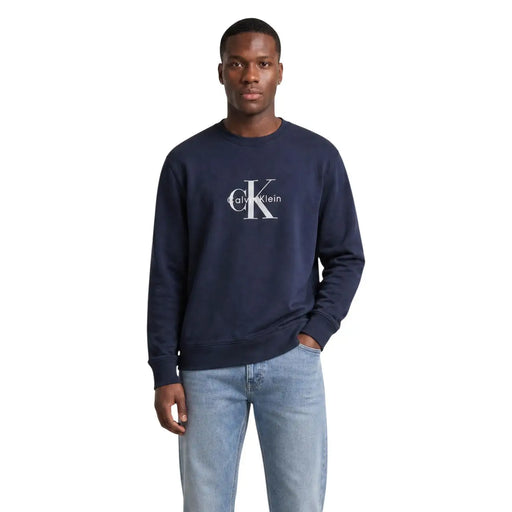 Navy blue Calvin Klein Jeans men cotton round neck sweatshirt with white CK logo on the chest